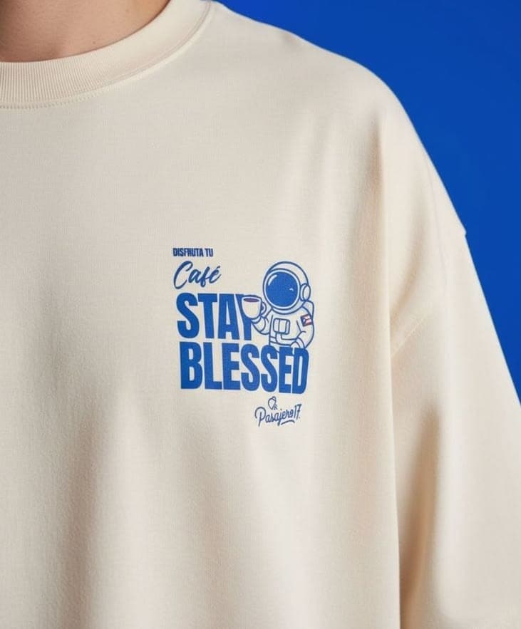 Cream tee with a blue astronaut chest print
